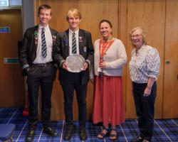 Winner Oran with fellow student and teacher at Crieff High School having received his award